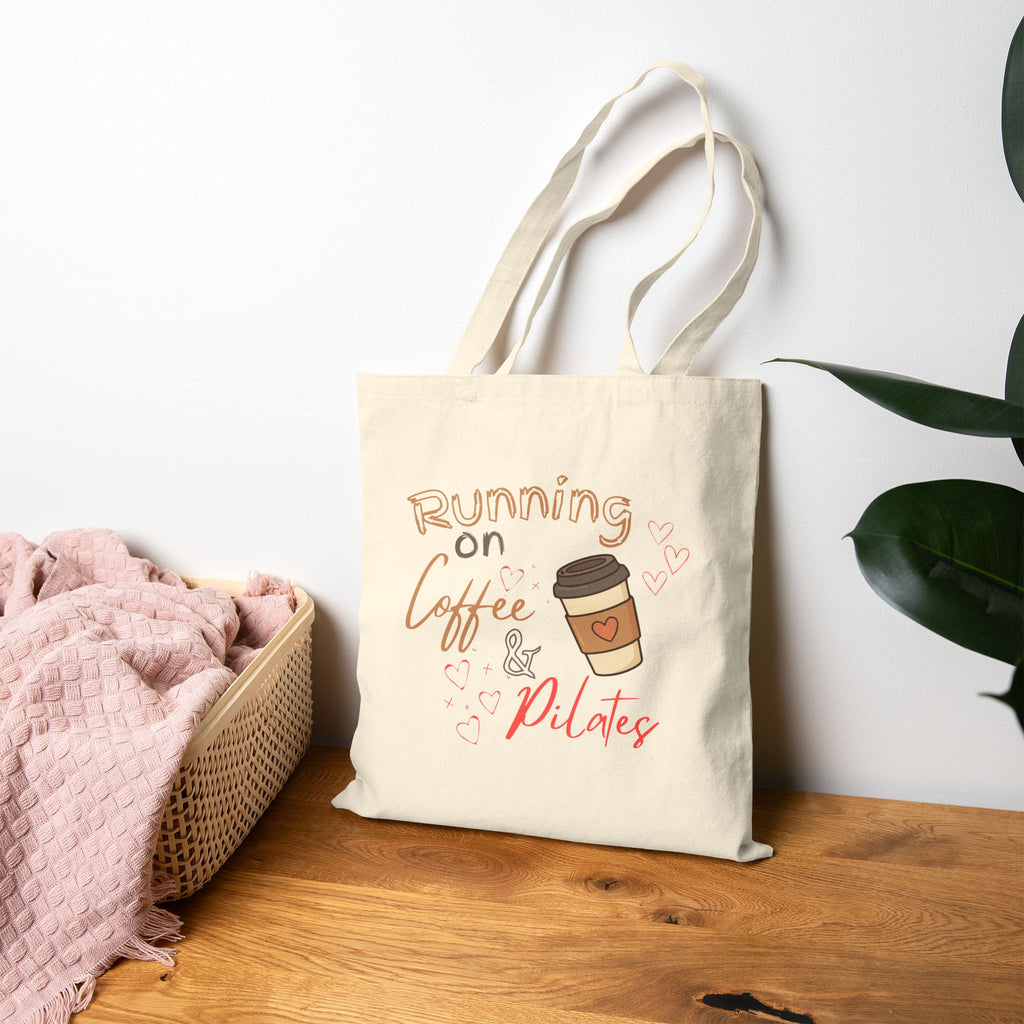 Tote Bag — "Running on Coffee & Pilates" Canvas Tote for Fitness Lovers